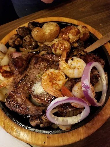 Sizzling cast iron plate at The Horseshoe Grill of Eureka Springs